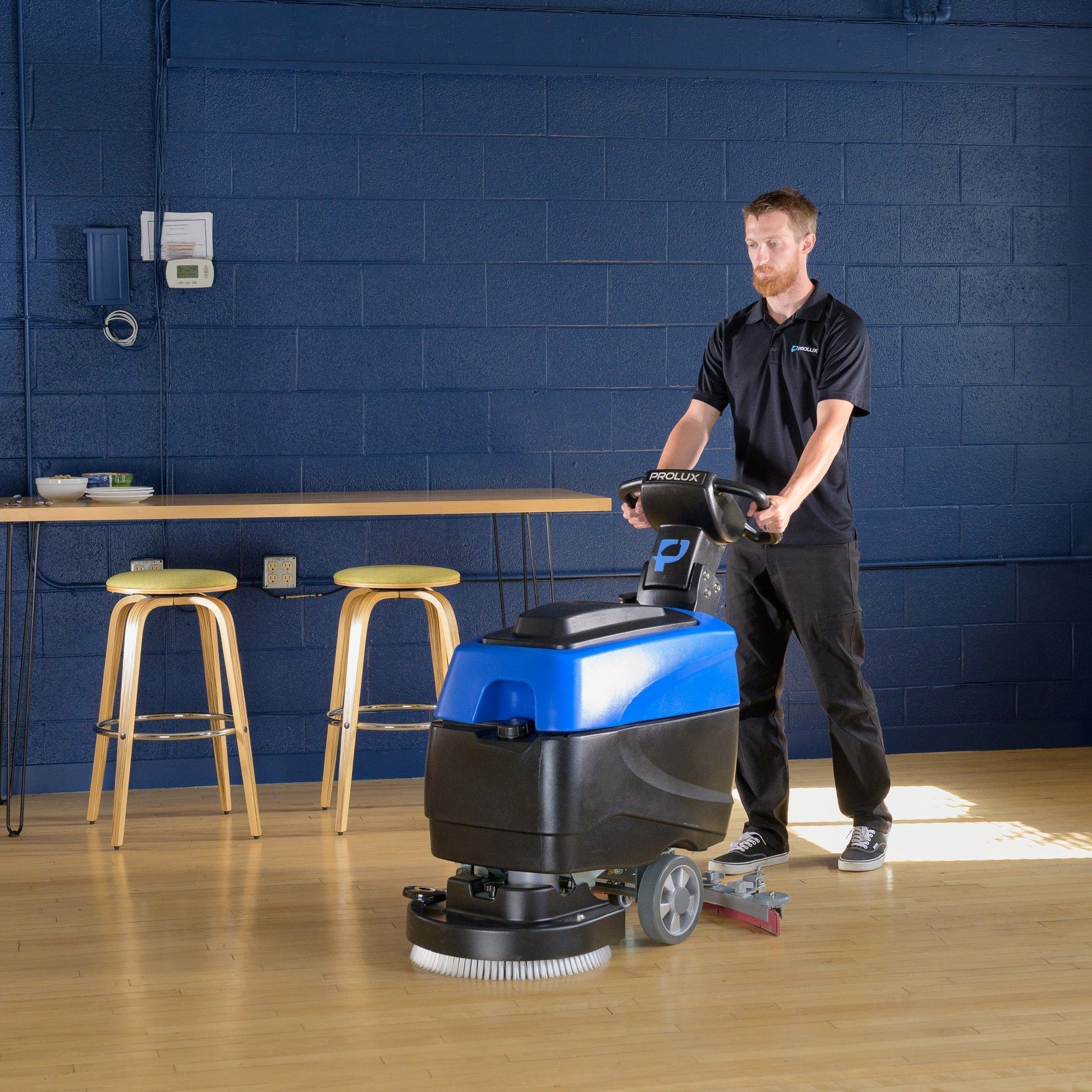 Prolux PLCC460S 18" Cordless Commercial Walk Behind Floor Cleaner, Scrubber and Buffer in use wood floor blue background

