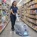 ONYX DX15 Autoscrubber 15in in use in aisle