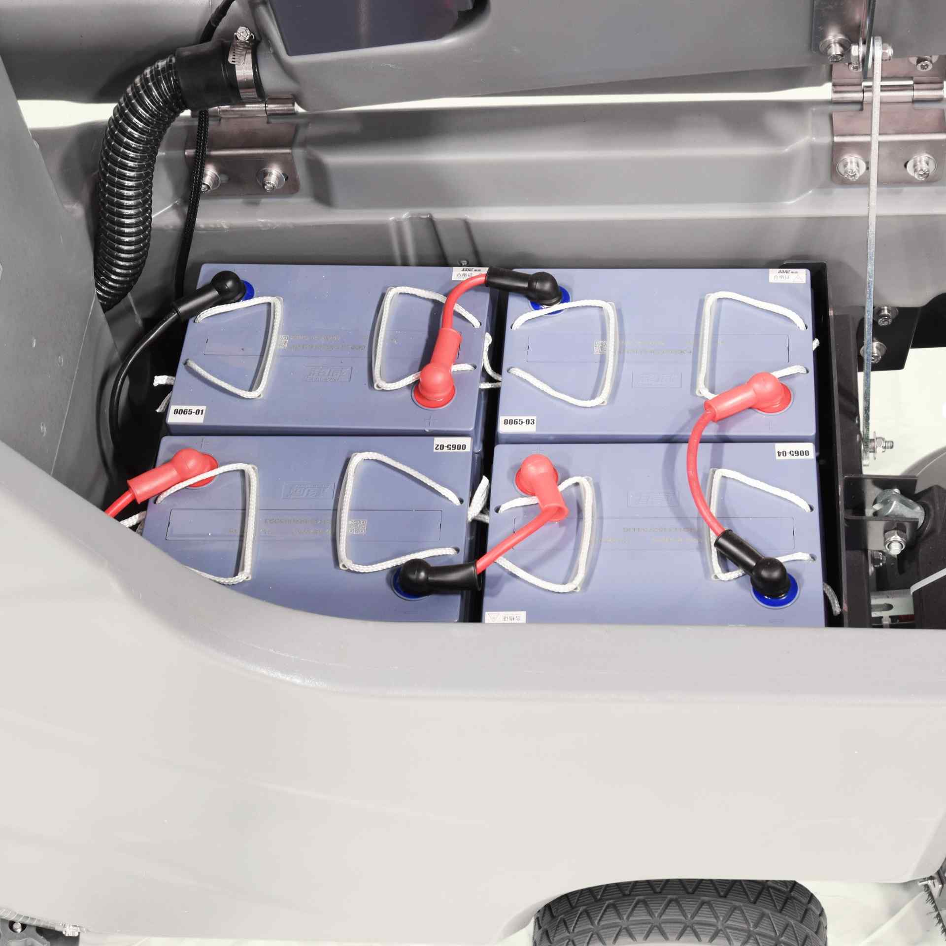 Batteries in ONYX DX26C floor scrubber with visible connections